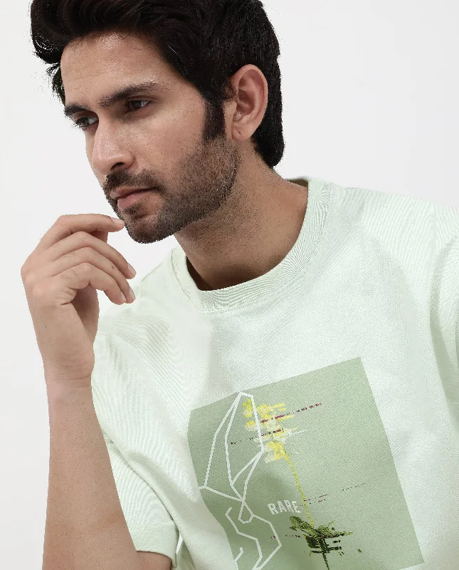 Casual Men's T-ShirtsRare Rabbit Articale Mens Luca Pastel Green Cotton Polyester Fabric Short Sleeve Crew Neck Oversized Fit Graphic Printed T-Shirt Casual Men's T-ShirtsRare Rabbit Articale Mens Luca Pastel Green Cotton Polyester Fabric Short Sleeve Crew Neck Oversized Fit Graphic Printed T-Shirt